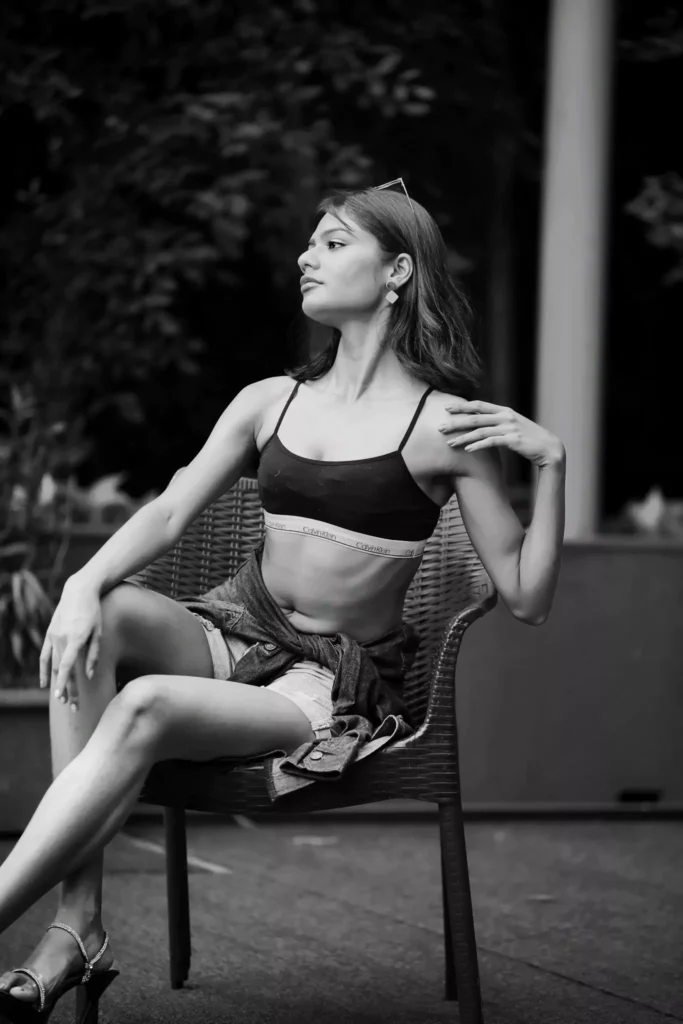 Side profile pose of fashion model exuding elegance in monochrome