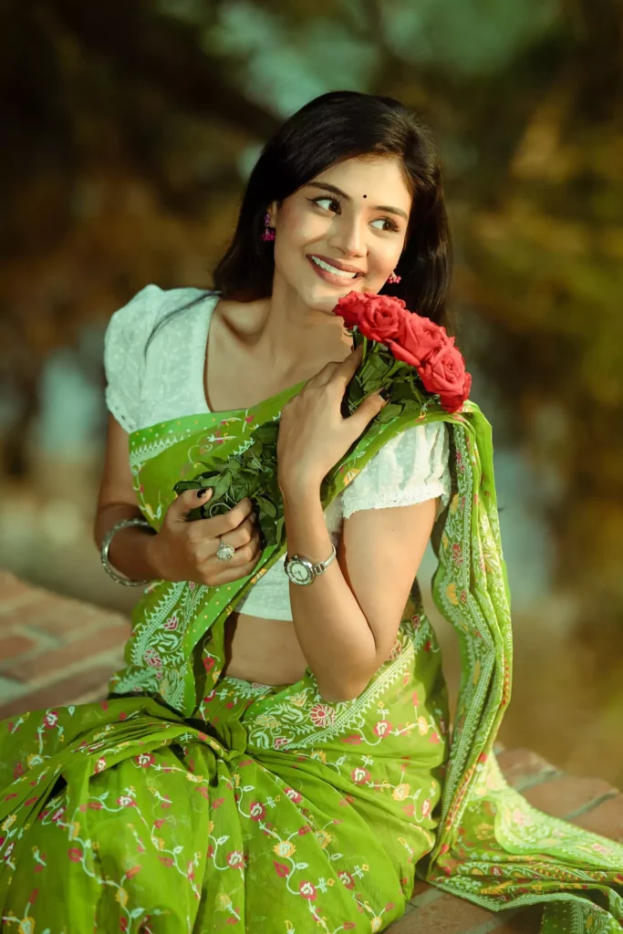 Woman glancing sideways holding bouquet.