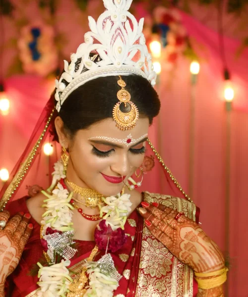 A beautiful bride adorned in a traditional Indian wedding dress, showcasing intricate designs and cultural heritage. A beautiful bride adorned in a traditional Indian wedding dress, showcasing intricate designs and cultural heritage.