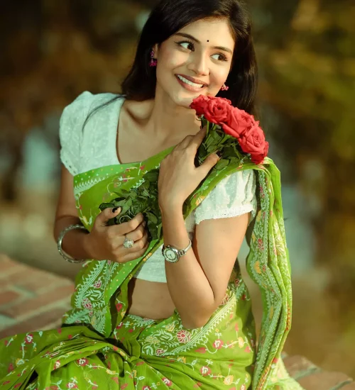Woman glancing sideways holding bouquet.